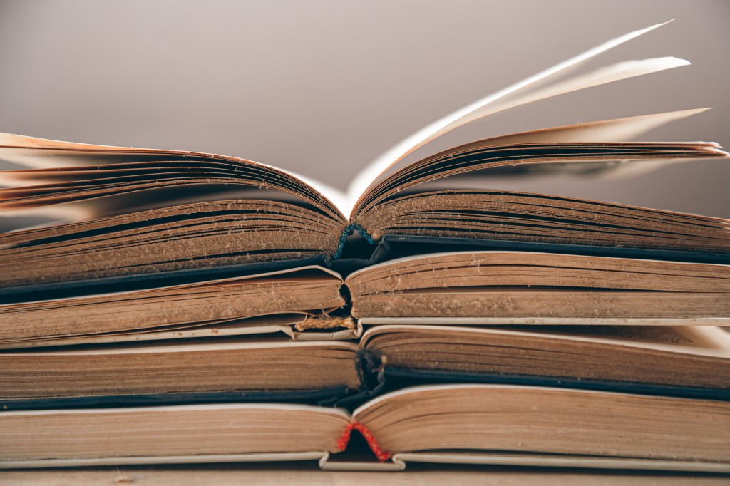 open old books stacked, close up, study and reading concept.